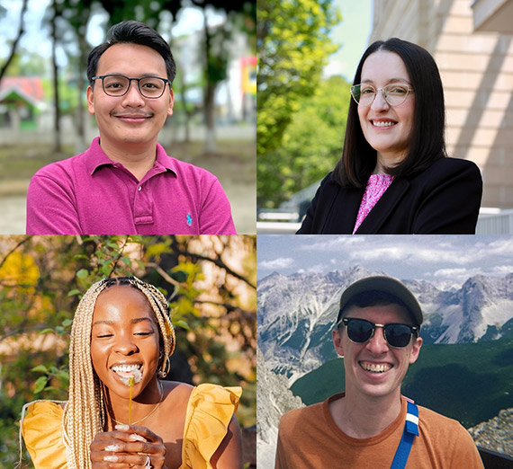 Wesley Schantz stands with students besides international flags in Gonzaga's Hemmingson Center. 
